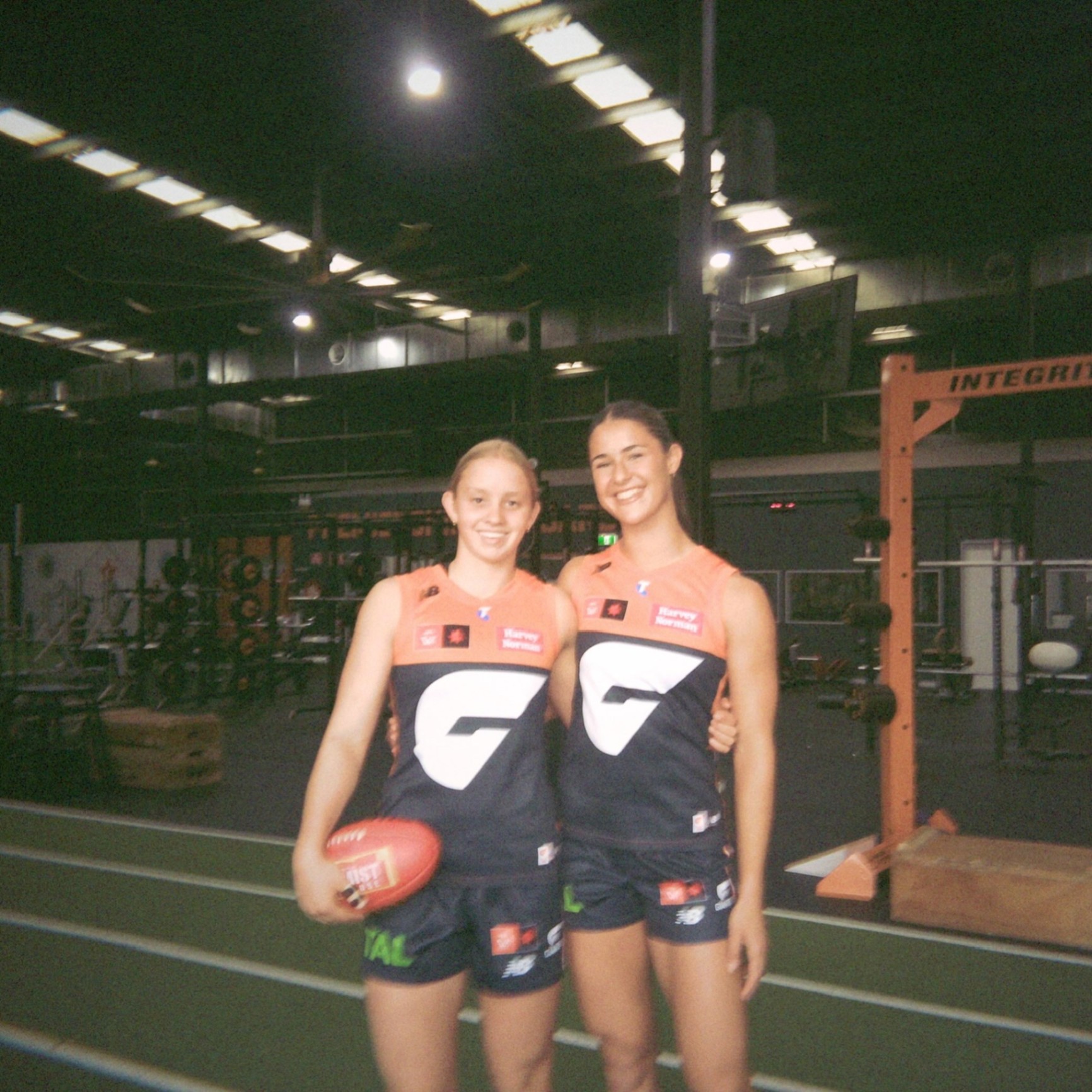Yasmeen Janschek and Sophia Gaukrodger in GWS guernseys — the co-founders of SHUT UP &.
